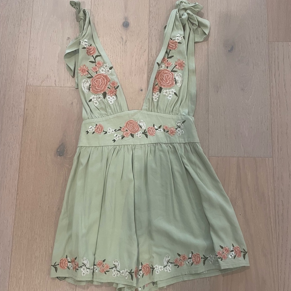 Cute sage romper with floral detailing size small